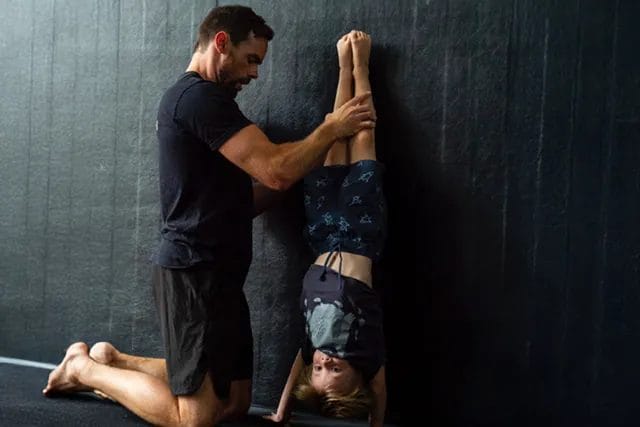 Holiday Workshops 35 kid training acro with his personal trainer at ModBod Kids