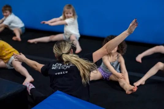Kids with coach on gymnastic training at ModBod Gymnastics