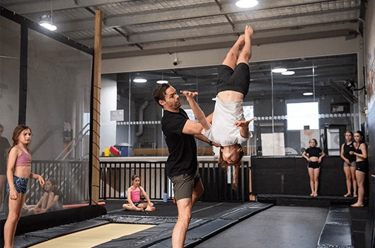 kid taking a tumbling class