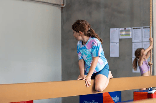 kid training on a bar