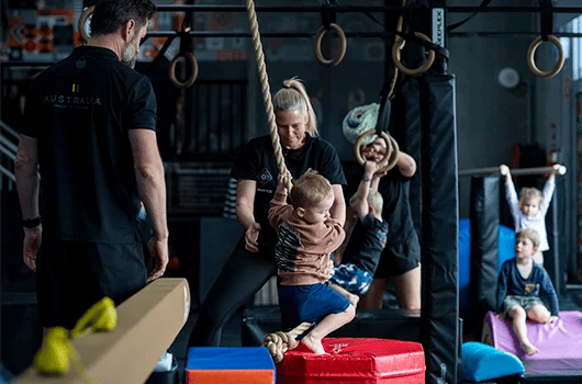little kid doing gymnastics